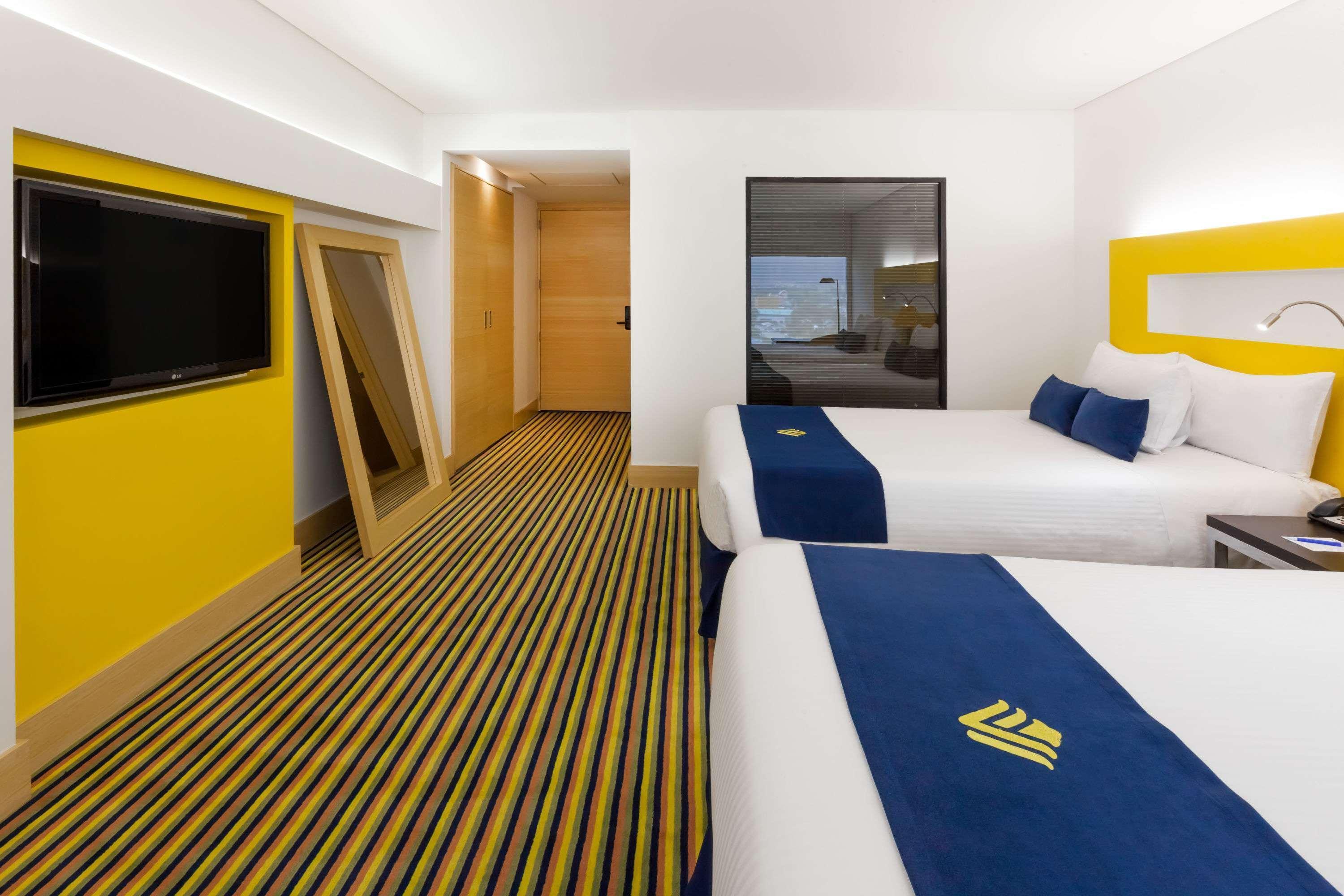 Hotel Wyndham Bogotá Exteriér fotografie A room at the hotel